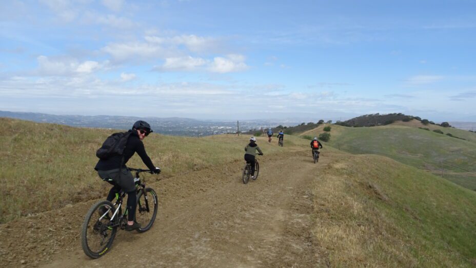 Mountain bikers riding along a ridge trail