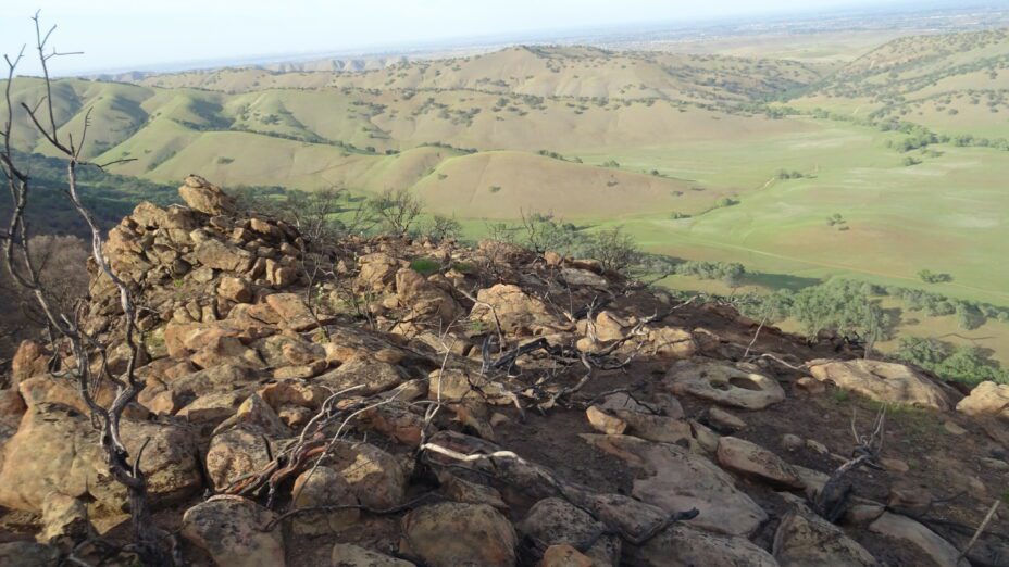 Barren rocks overlooking lush hills