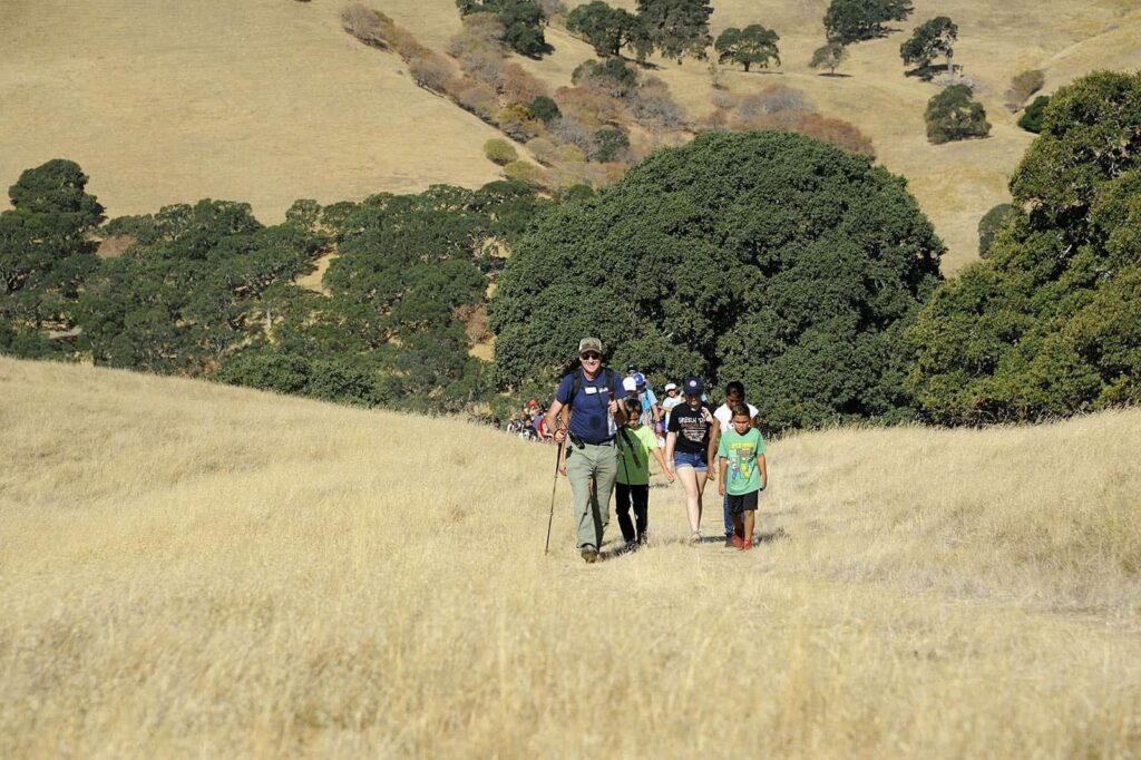 Save Mount Diablo Executive Director Ted Clement leads a group of students and their families and teachers on a hike to create an image in support of the Global Climate Strike