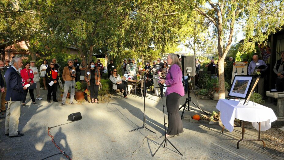 People gathered around a speaker