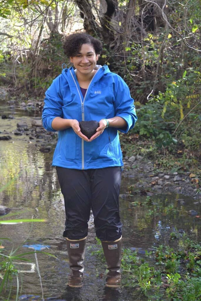 Emily King standing in a Bay Area stream