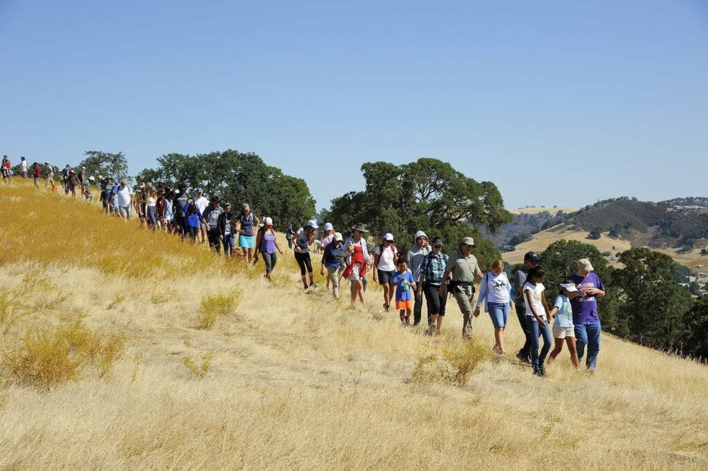 Students, their families, teachers, and Save Mount Diablo volunteers and staff hiking back after creating images in support of the Global Climate Strike