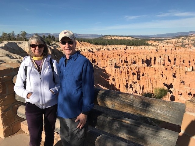 Two people standing in foreground