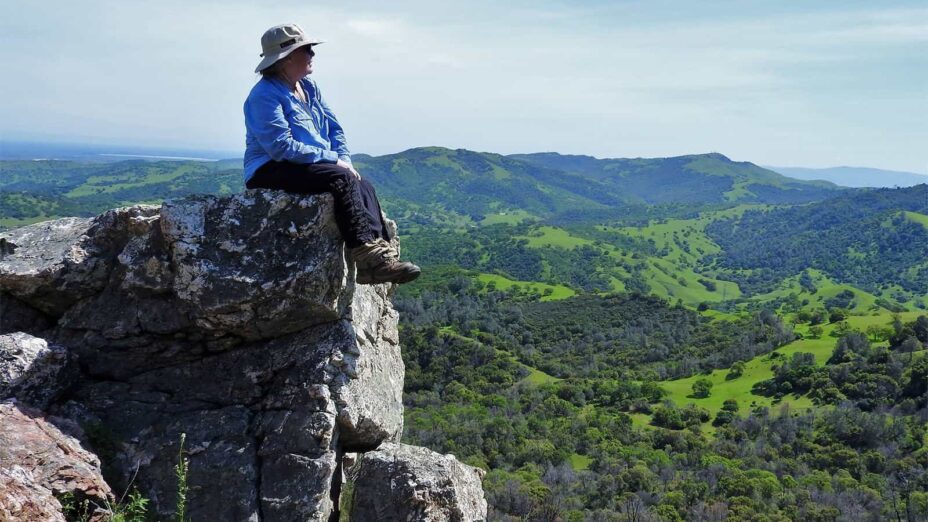 Kathleen Roth sitting on a rock in Viera-North Peak