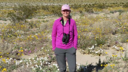 Maren Smith in a field of wildflowers