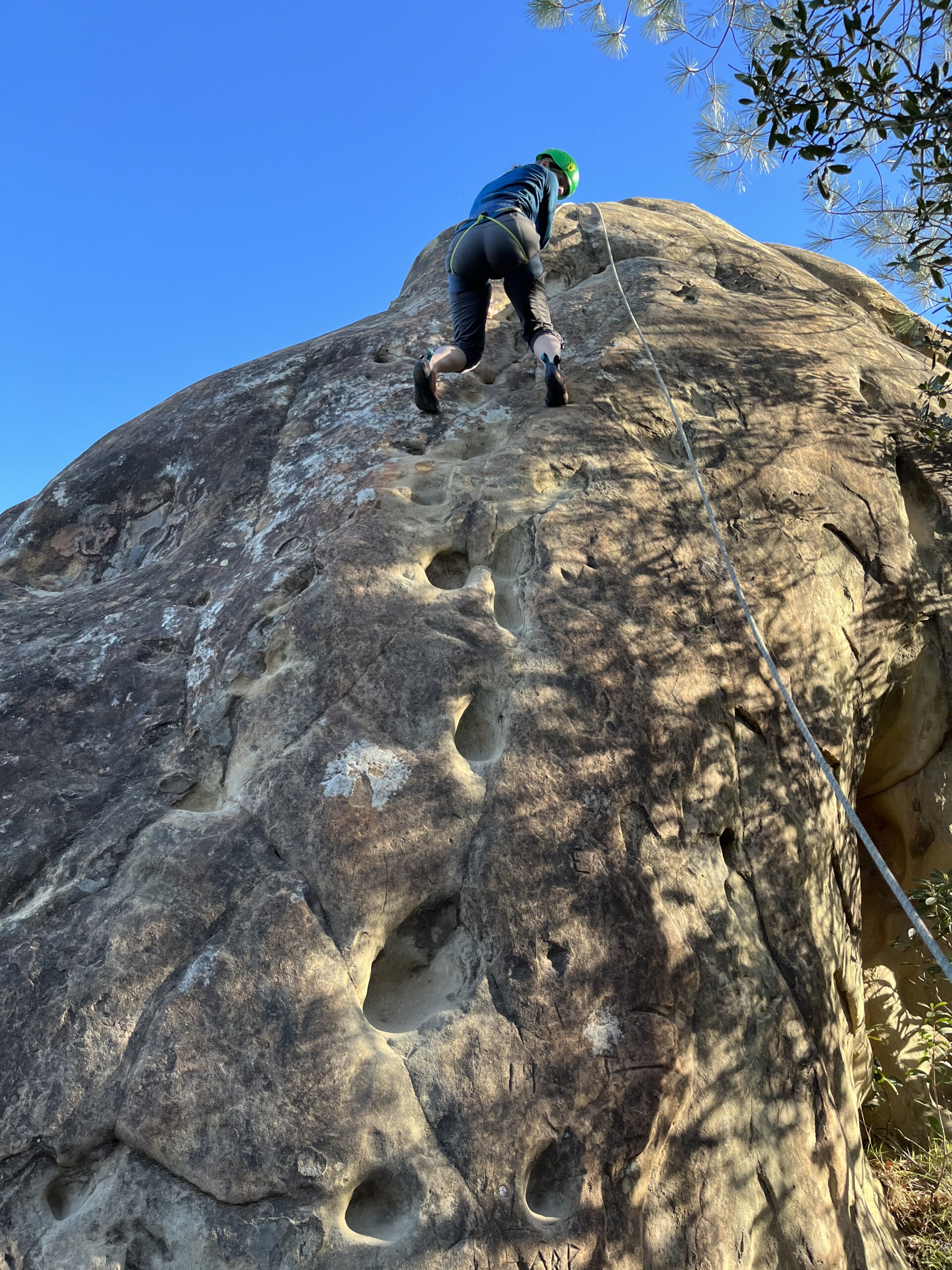 Rock climber scaling a cliff