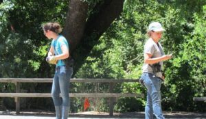 two researchers tracking squirrels