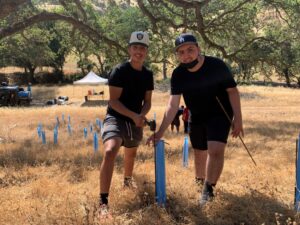 students plant trees at curry canyon ranch in summer