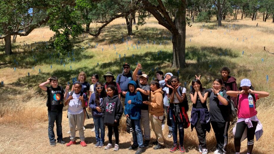 CARES workday group photo in front of trees at curry canyon