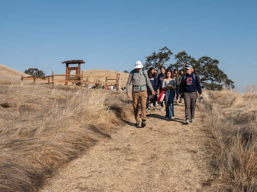 Campolindo High School students and Save Mount Diablo Executive Director, Ted Clement head into the preserve.