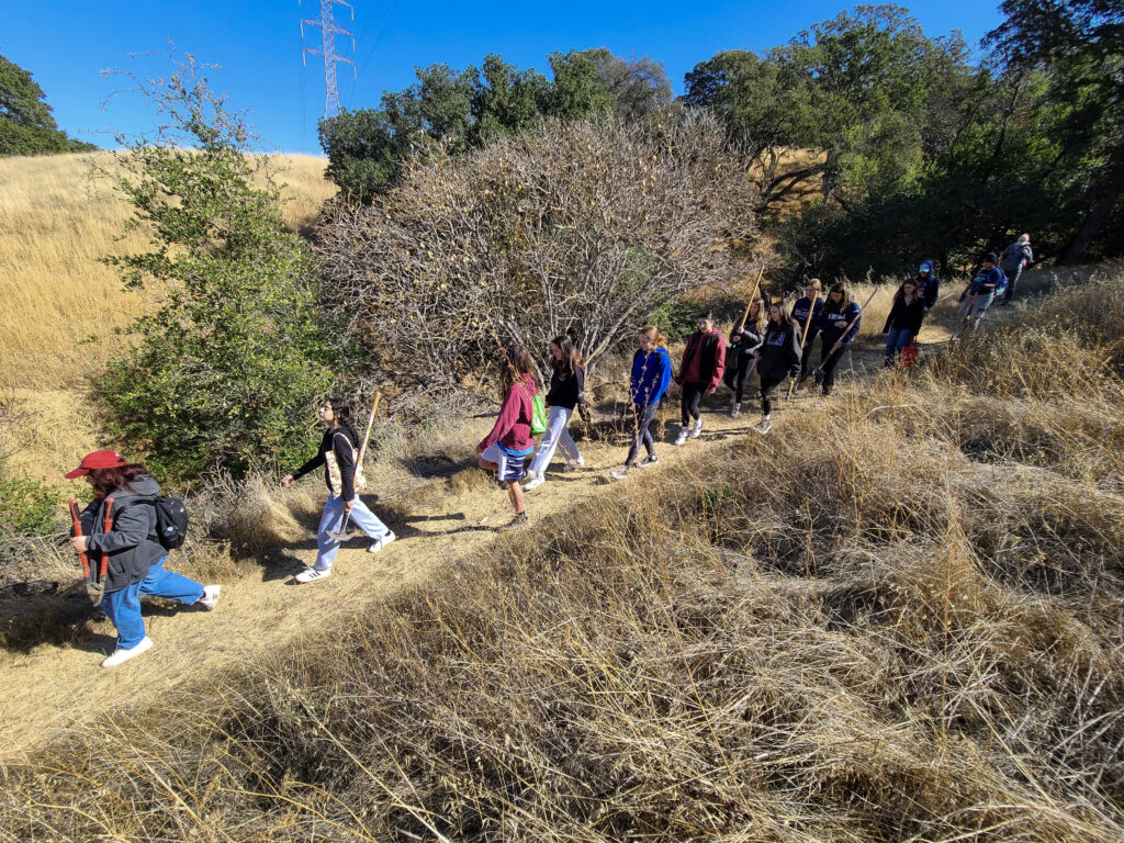 Campolindo High School students hiking to their service project site.
