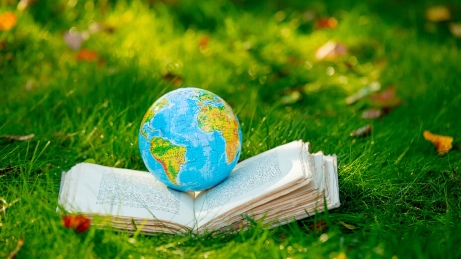 Earth globe on book