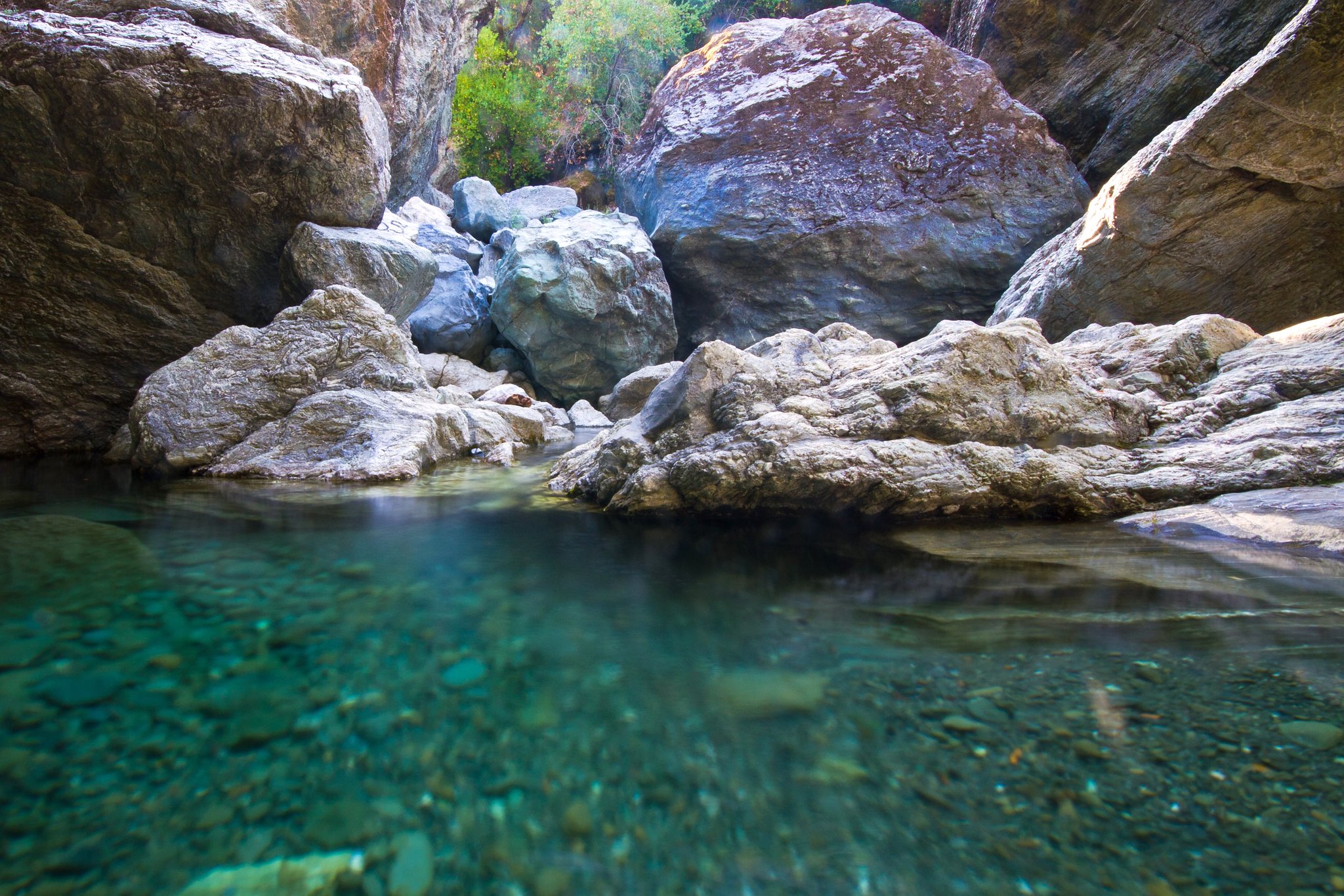 A shallow pool of clear, blue water along Alameda Creek in the Sunol Regional Wilderness near the Canyon View Trail, Little Yosemite 