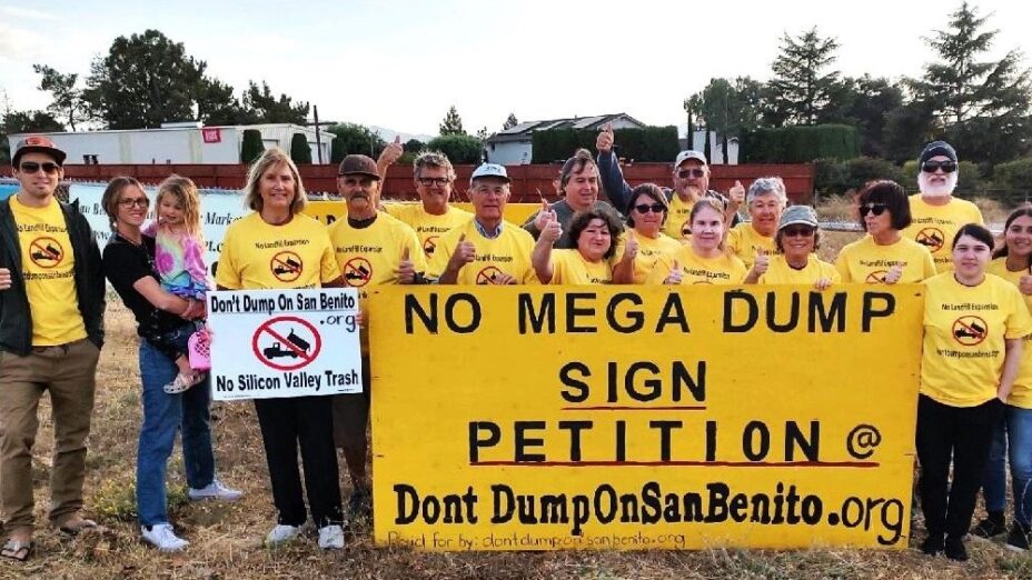group photo of people holding a sign that says: NO MEGA DUMP SIGN PETITION DontDumpOnSanBenito.org