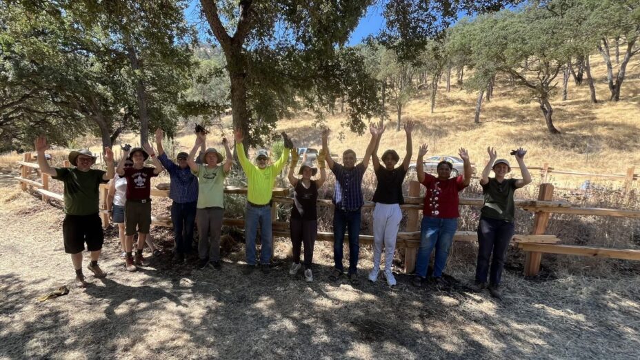 Volunteers and staff at Marsh Creek 7 in front of the new split rail fence