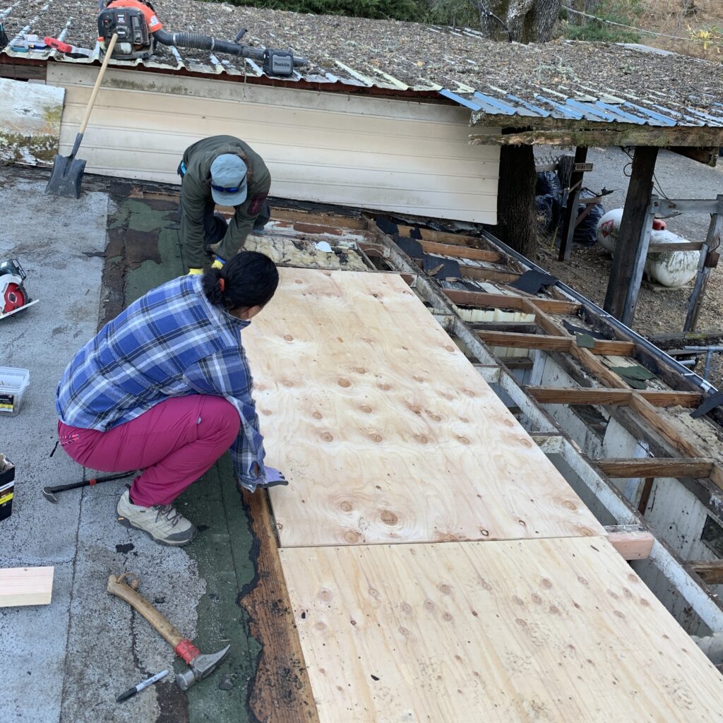 Staff replacing roof at Wright Canyon