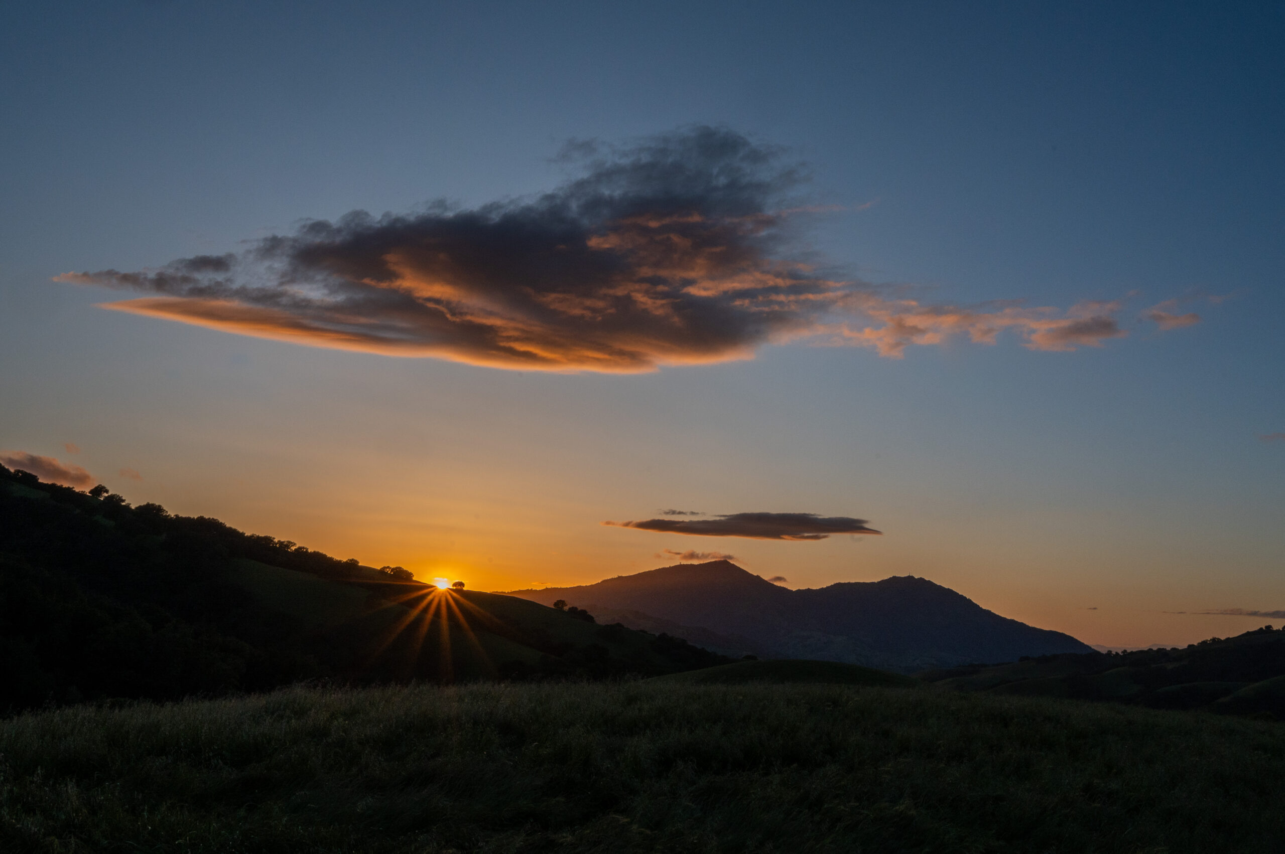 the sun sets on Mount Diablo