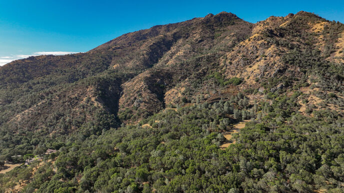 Aerial view of the Nunn-Paulsen inholding's steep and wooded terrain